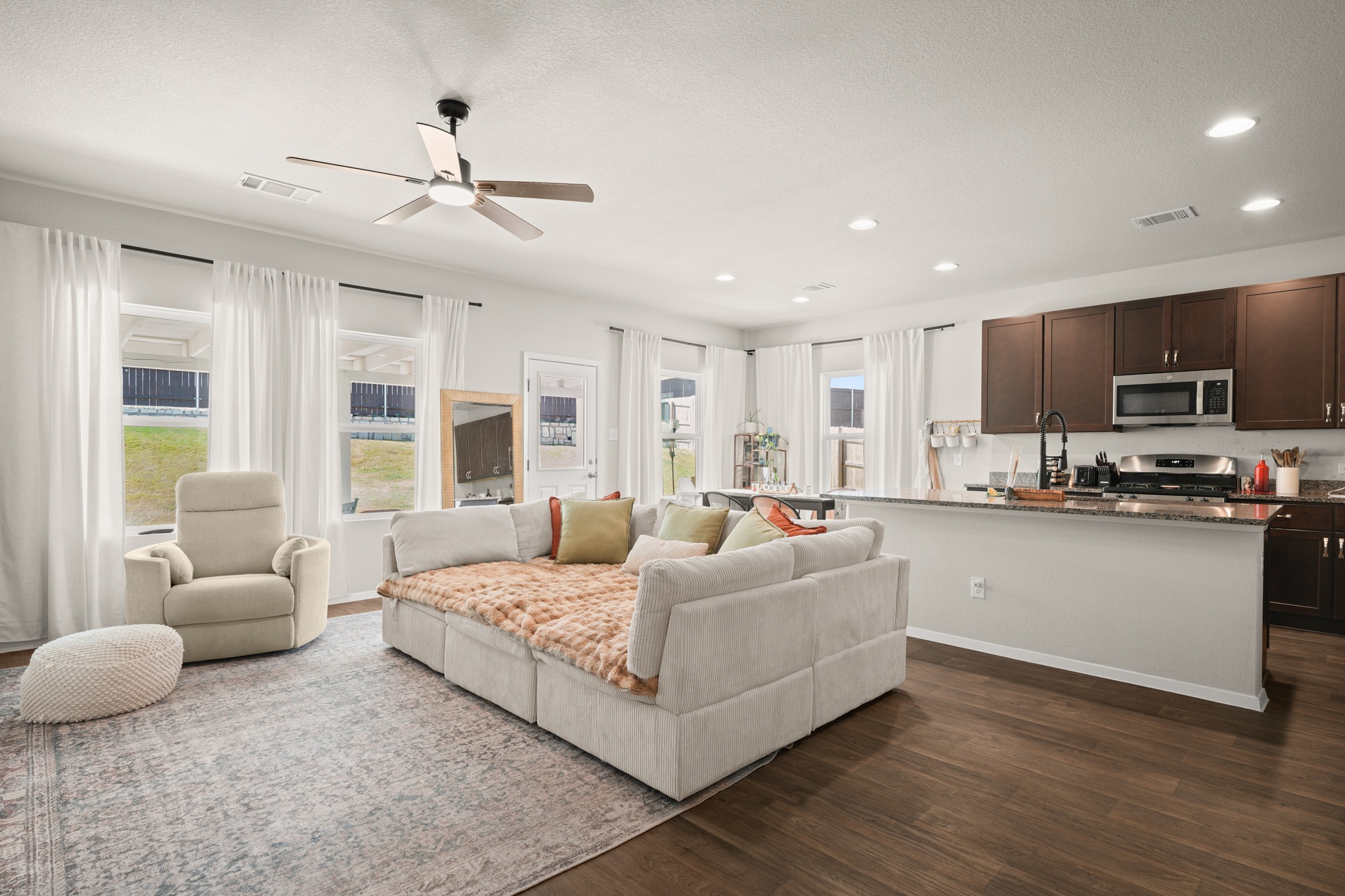 Open living room and kitchen at 5521 Sacra Cove