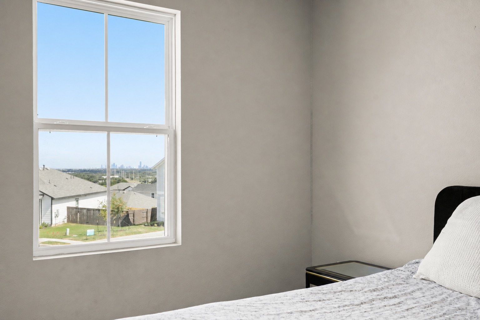 Distant view toward downtown Austin from an upstairs bedroom